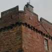 Detail of tower showing corbel course and gable raggle