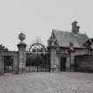 View of gates and lodge from W.