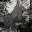 View from N showing blocked openings in gable and 19th century additions.