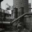 Newtongrange, Lady Victoria Colliery, Boiler House and Chimney (Original Boiler House)
Detailed view from NE of steam main (foreground), with two riveted fabricated steel pressure vessels situated in front of base of boilerhouse chimney.  The headframe can also be seen in the distance (left)