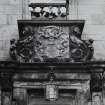 Detail of armorial panel above entrance doorway, E elevation.