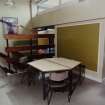 Interior.
Detail showing tables and chairs in study/dining area.