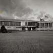 View from S of Office and Canteen block, also showing flagpoles.