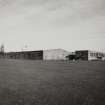 General view from SW of main block containing Cased Goods Stores, Bottling Hall, and Office and Canteen block.