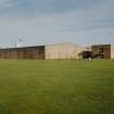 General view from SW of main block containing Cased Goods Stores, Bottling Hall, and Office and Canteen block.