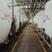 Interior.
View from E of tanks in whisky reduction department.