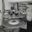 Interior. Projection room, view showing projector and rewinding discs