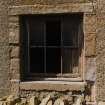 Detail of window at basement level of E gable.