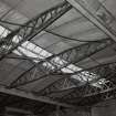 Interior view of workshops showing detail of wooden roof trusses
