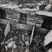 Interior.
Byre, view of stalls in W wall.