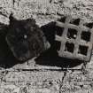 Detail of fragments of terra-cotta kiln-plates from earlier mill.