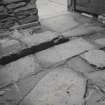 Interior.
Building adjacent to number 5 Bridge Street, now demolished, detail of gutter in ground floor.