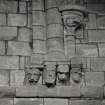 Interior.  Choir, detail of head shaped corbels at upper level