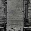 Interior.  Nave, view of carved grave slab