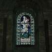 Interior.  Nave, N aisle, 5th bay from W, detail of stained glass window (St. Christopher)