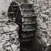 View of water wheel against N gable.