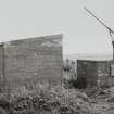 View of pump house and hand pump from NW