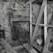 Interior.
Ground floor, view of kitche and remains of stove.