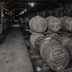 Duty Free Warehouse No. 3:  view of traditional storage for casks, showing wooden rails and earth floor