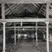 Campbeltown, Millknowe Road, Hazelburn Distillery, interior.
View of Top Floor North-West maltings block from South-West (formerly granary) with queen-post roof trusses on cast-iron columns.