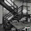 View of Kitchen from East showing open tread staircase.