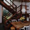 View of Kitchen from East showing open tread staircase.