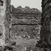 Castle Sween, interior.
View of East wall of courtyard showing blocked gable.