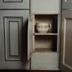 Inveraray Castle, interior.
View of a cupboard concealed in the panelling containing a chamber-pot.