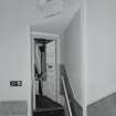 Interior.  Auditorium, W staircase, view of doorway and stair leading to box