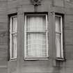 Glasgow, Rutherglen Road.
General view of bay window with decorative carving above.