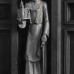 Interior. View of carved wood figure of St. Joseph holding a model of the church