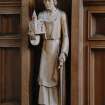 Interior. View of carved wood figure of St. Joseph holding a model of the church