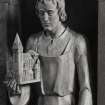 Interior. Detail of carved wood figure of St. Joseph holding a model of the church.