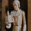 Interior. Detail of carved wood figure of St. Joseph holding a model of the church.