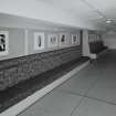 Interior.  Corridor outside stalls bar, view from E