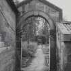 Glasgow, 6 Rowan Road, Craigie Hall, interior.
View of garden entrance arch of caretaker's house from East.