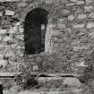 Detail of arched window and outside wall.