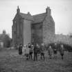 Exterior view of house with children in front