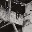 Glasgow, 13-23 Tradeston Street, Randolph & Elder Engine Works, interior.
View of strainer truss and gantry, detail of intermediate roof stanchion and housed binding straps.
