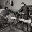 Glasgow, Springburn, St Rollox Locomotive Works, interior.
View of carriage wheel turning lathe in operation.