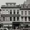 View of 96, 102 - 104 St Vincent Street from SW at junction with Renfield Street, also showing Malcolm Campbell, Fast Frame and Barclays.