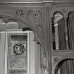 Ground floor, bar (former drawing room), window, decorative wooden screen, archway, detail