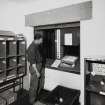 Interior.
View of post room showing paper lift system.