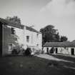 General view of house and outbuildings from SW.