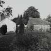 General view of house and outbuildings from SE.