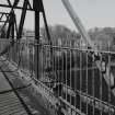 Blantyre, Station Road, David Livingstone Memorial Footbridge
Slightly oblique view from W along deck near to centre of bridge, with the River Clyde visible through the railings