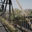Blantyre, Station Road, David Livingstone Memorial Footbridge
Slightly oblique view from W along deck near to centre of bridge, with the River Clyde visible through the railings