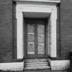 Entrance front, SW doorcase, detail