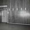 Interior.
Ground floor, banqueting hall, W wall, detail of Emergency Exit sign and row of lights.