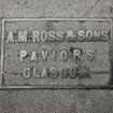 Interior-detail of trade plate on platform floor -"A.M.Ross & Sons  Paviors, Glasgow"